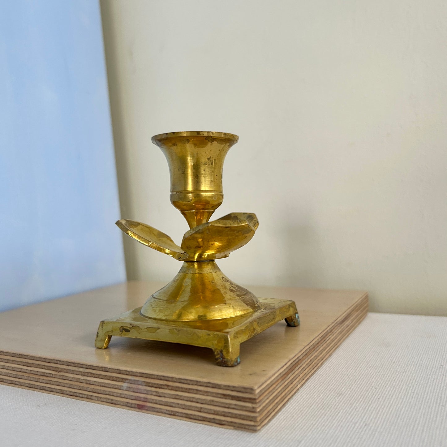 Hand-worked brass candle holder