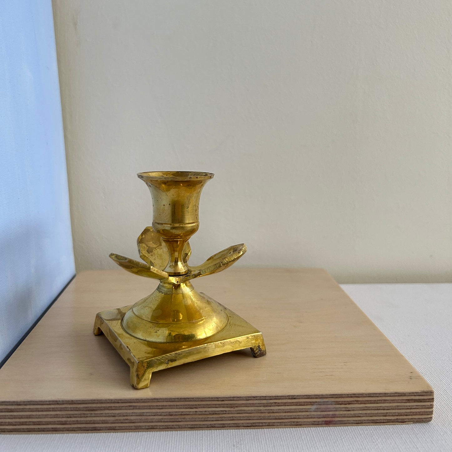 Hand-worked brass candle holder