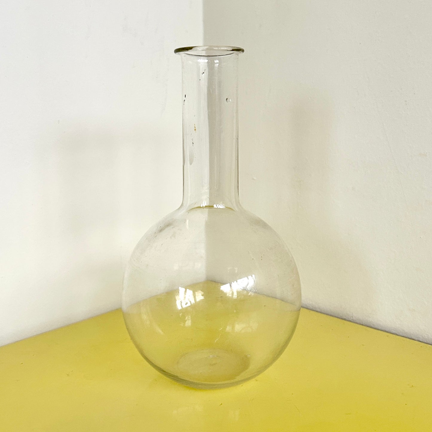 Hand blown long stem glass vessel