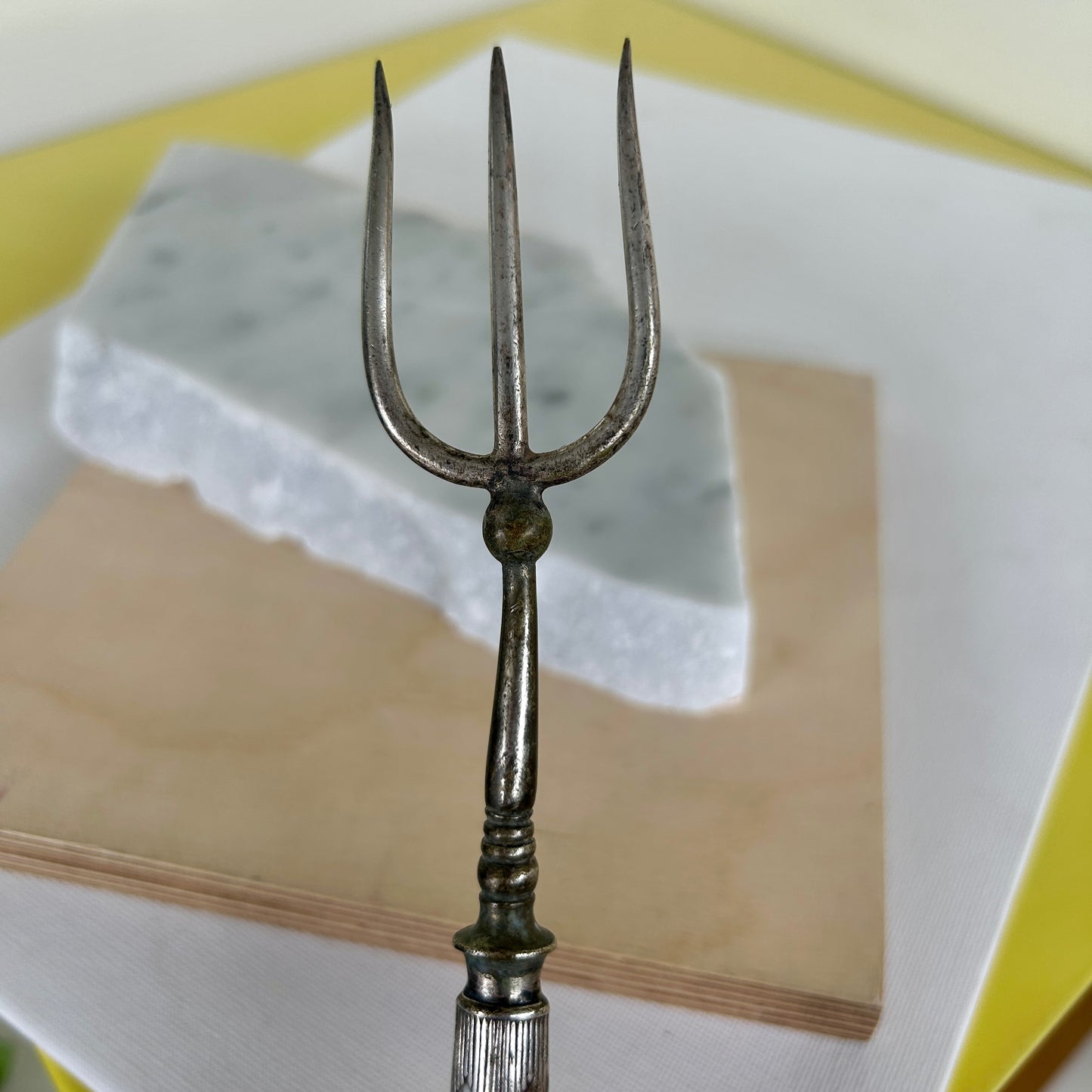 Antique serving fork with silver-plated handle