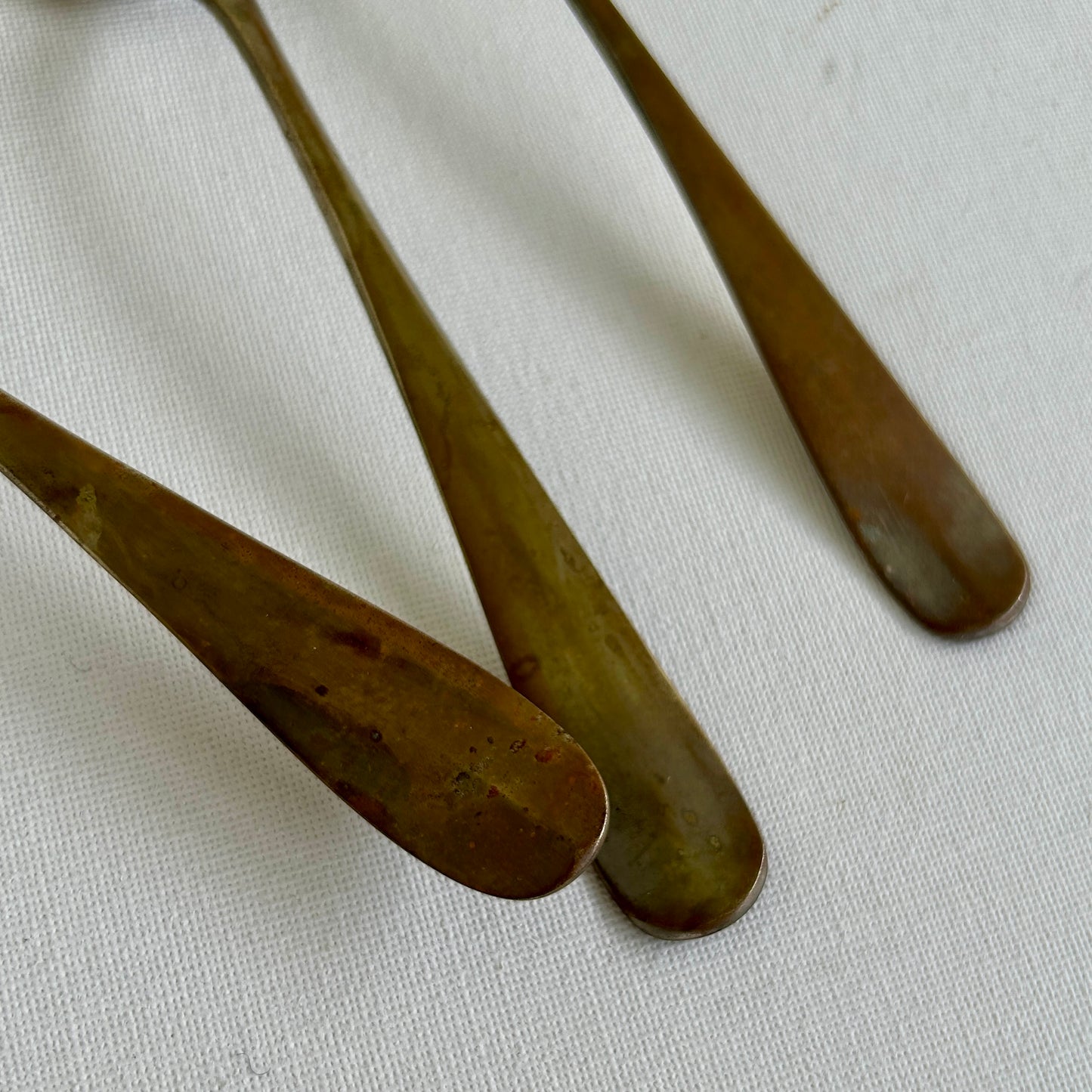 Antique handmade spoons, alpaca with brass finish